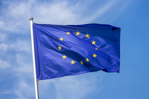 EU flag on a flagpole blowing in the wind